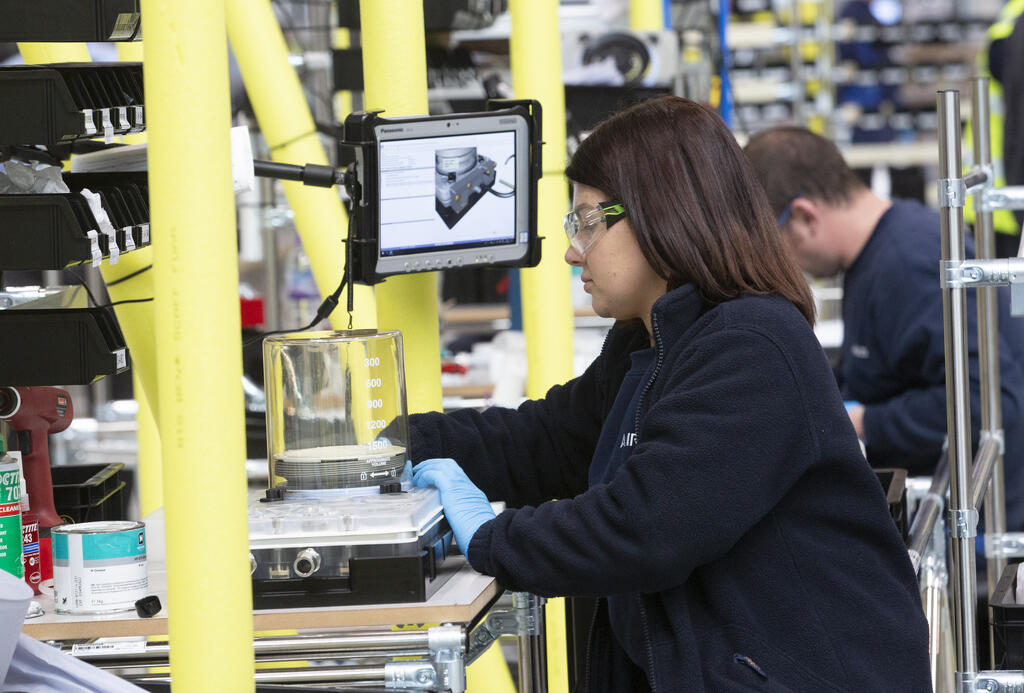 An Airbus engineer manufacturers a component of the Penlon ventilator at AMRC Cymru.